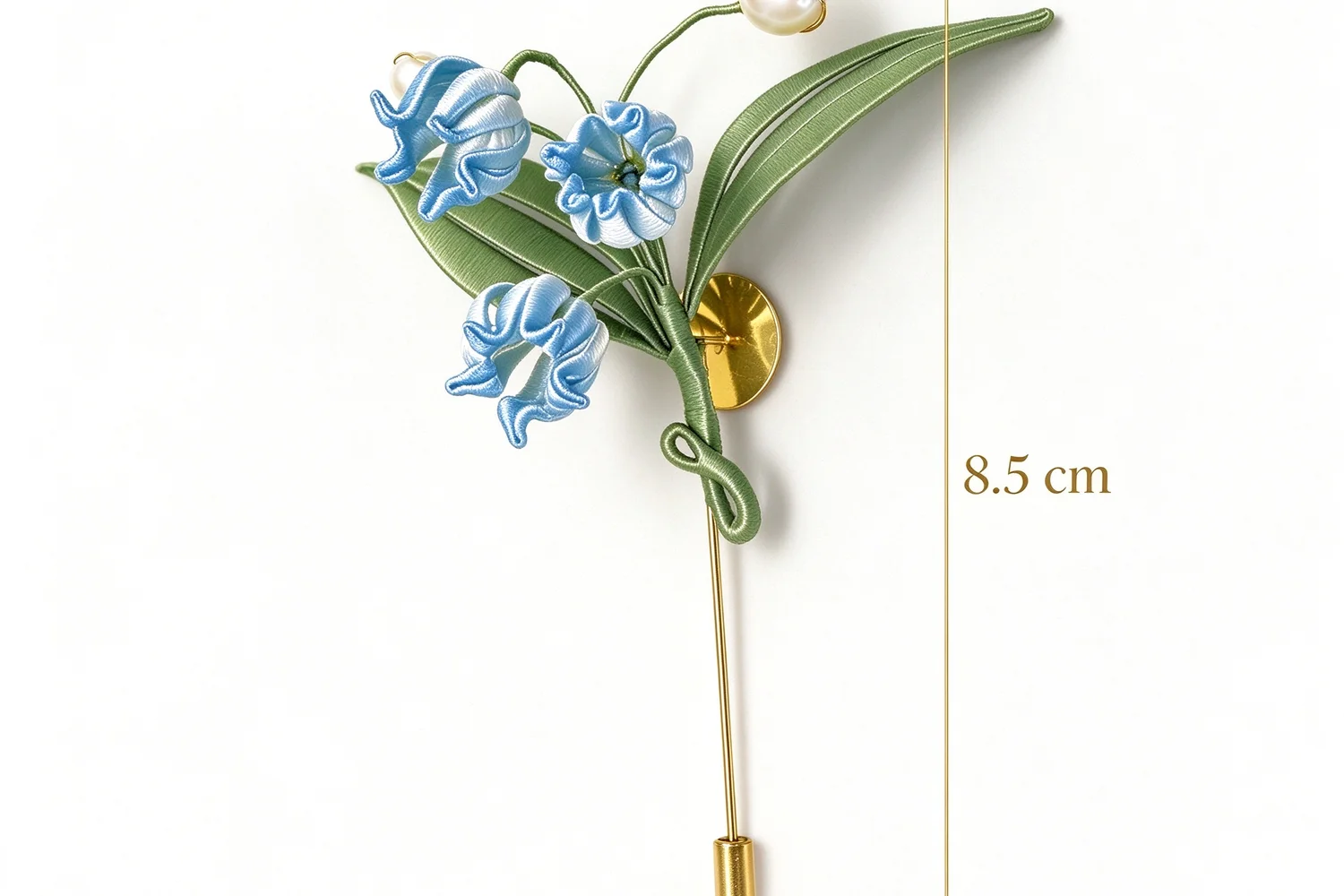 The piece measured with a size chart showing its 8.5 cm length